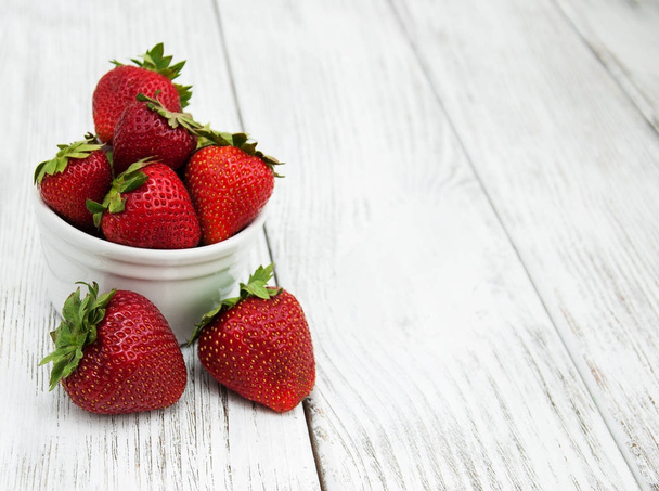 ripe strawberries on wooden table - 写真・画像