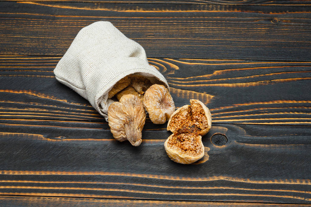 dried figs isolated on wooden background - Photo, Image