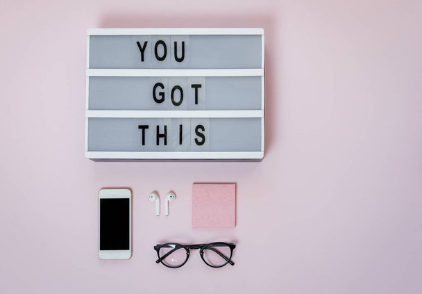 Motivational board, phone and stationery on pink table. Business - Foto, imagen