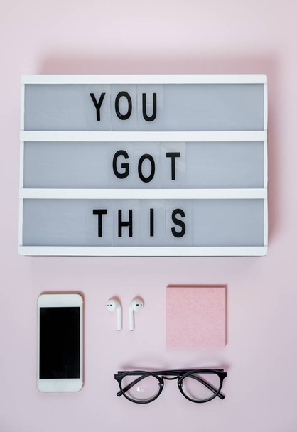Motivational board, phone and stationery on pink table. Business - Valokuva, kuva