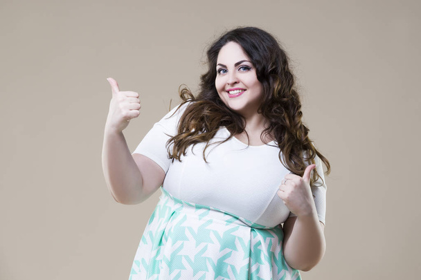 Happy plus size fashion model, sexy fat woman on beige background - Φωτογραφία, εικόνα