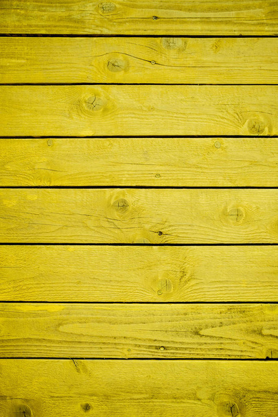 Old wooden board with yellow paint, texture. - Zdjęcie, obraz