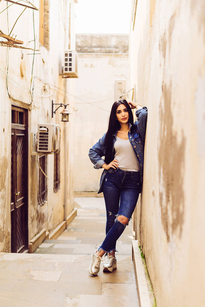 stylish young tourist girl travels through Europe, the city of Baku in Azerbaijan - Photo, Image