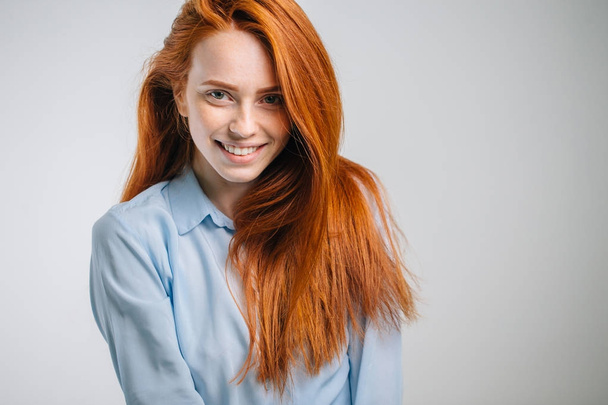Young attractive redhead girl smiling looking at camera. - Valokuva, kuva
