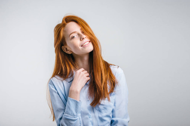 Young attractive redhead girl smiling looking at camera. - Фото, изображение