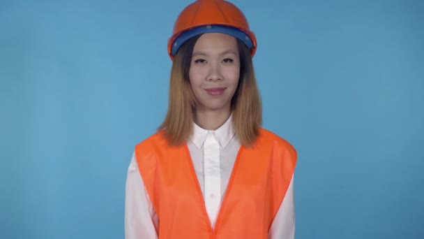 beautiful korean female builder shows hand gesture okey - Footage, Video
