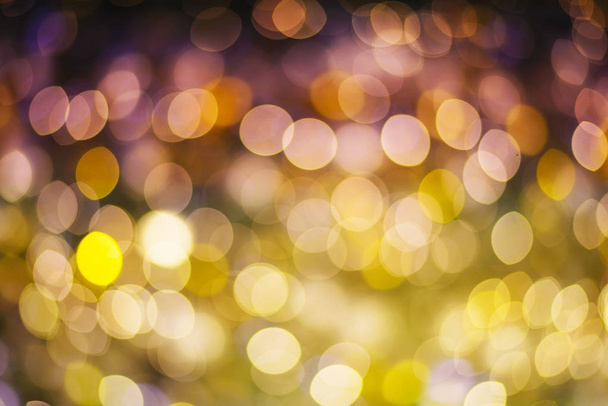 Gold and purple abstract bokeh or defocused background glitterin - 写真・画像