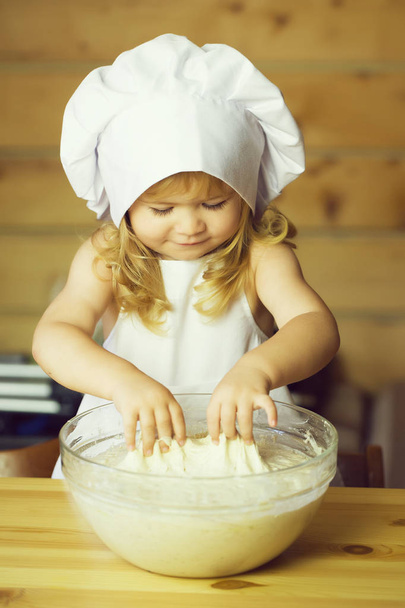happy boy child cook kneading dough - Zdjęcie, obraz