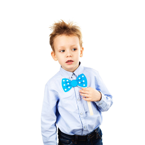 Cute little school boy with blue paper bow-tie isolated on a whi - Photo, Image