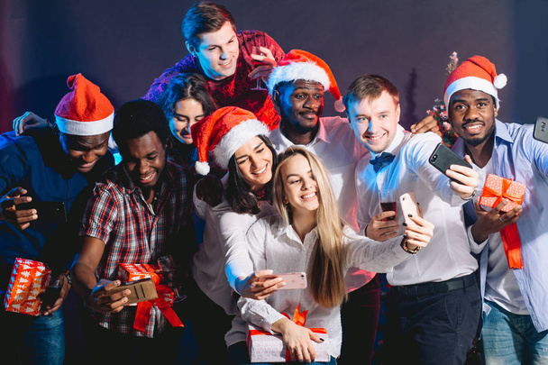 friends at club making selfie and having fun. Christmas and New year concept - Fotoğraf, Görsel