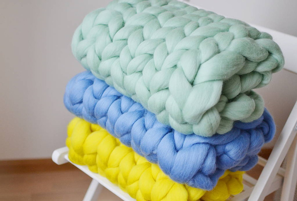 Giant Pink Mint Yellow Blue Plaid Woolen Knitted on White Wooden Stool Chair Home - Foto, Imagen