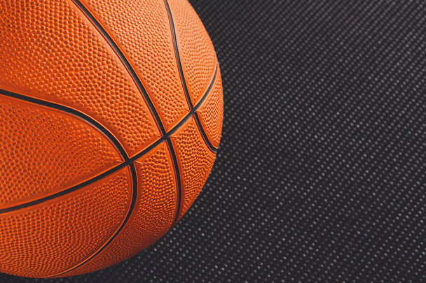 Basketball ball on black background copy space - Fotografie, Obrázek