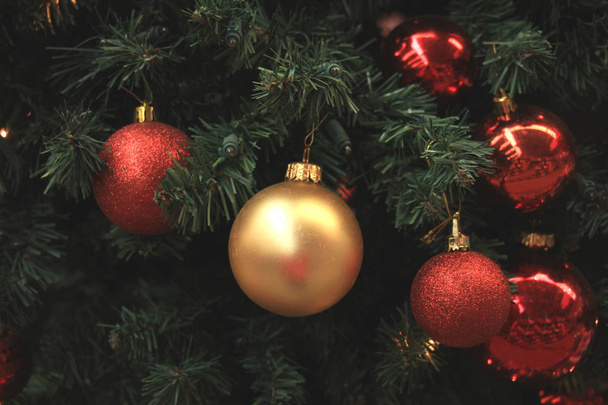 Red and gold Christmas ornaments - Фото, зображення