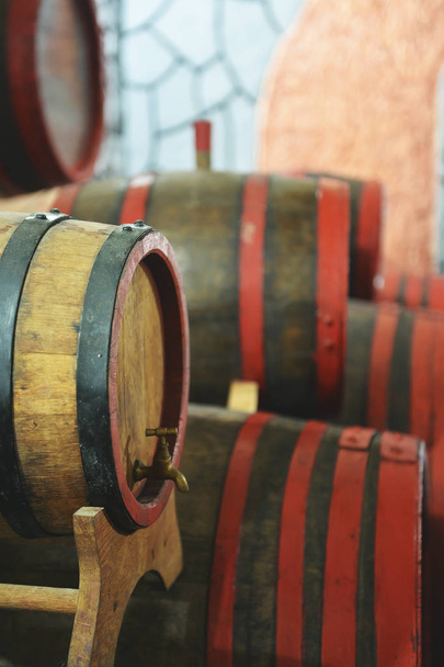 barrels of fresh wine, lie in a wine cellar - Photo, Image