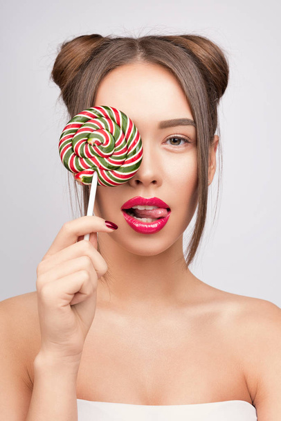 Beauty fashion model with colourful lollipops.  - Фото, зображення