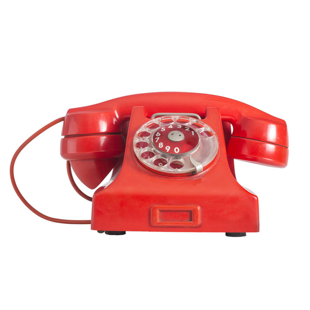 rotes altes Telefon mit Drehrad, isoliert auf weißem Hintergrund, Auswahlpfad verschmolzen - Foto, Bild
