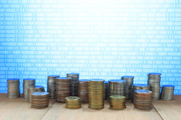 Digital economy. Coin stack with blue binary digital numbers background. Business, finance and saving concept. - Photo, Image
