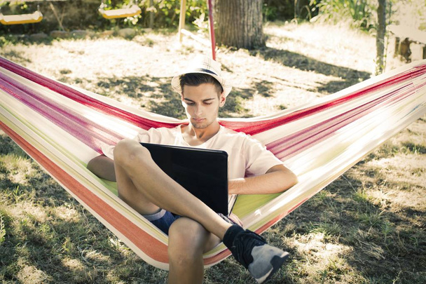 man in the hammock with laptop - Photo, image
