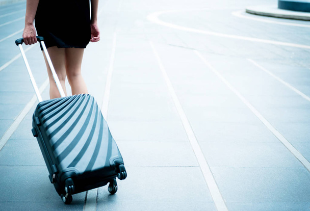 Young business traveller concept. Young business woman with blac - Fotoğraf, Görsel
