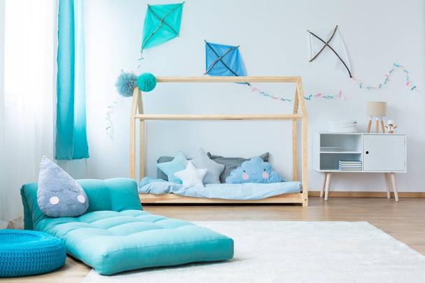 Blue child's bedroom with mattress - Фото, изображение