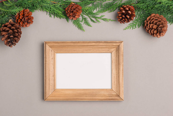 Christmas or New year gift boxes collection wrapped in kraft paper and blank photo frame for text. - Фото, изображение