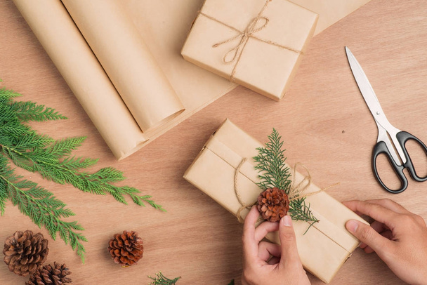 wrapping Christmas presents over wooden background - Foto, immagini