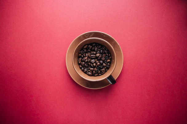 cup of black coffee and coffee beans on dark background  - Фото, зображення