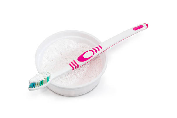 Toothbrush with toothpowder on an open box of toothpowder - Photo, Image