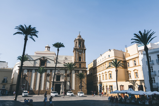 view of street with church, palms and automobiles, spain - Zdjęcie, obraz