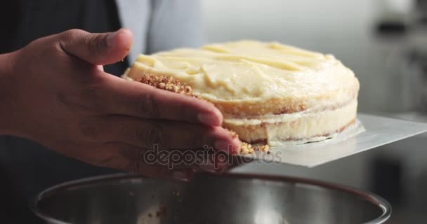 Adding cream and fruit to cake - Кадры, видео