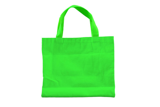 Isolated reuseable green fabric bag for environment conservation campaign and for shopping. - Photo, Image