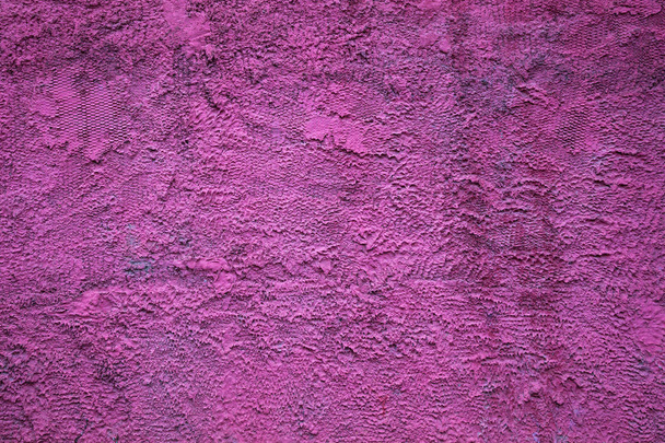 Abstract background texture of a rough concrete wall bright purple color. The rough blank surface - Foto, Bild