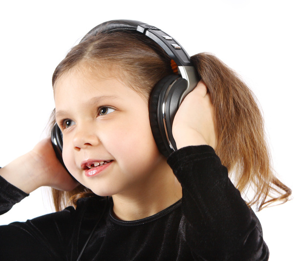 Kislány fülhallgatóval - Fotó, kép