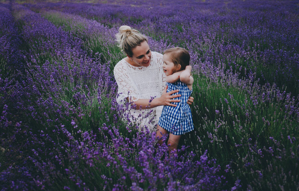 Mom and daughter in lavender. - Фото, зображення