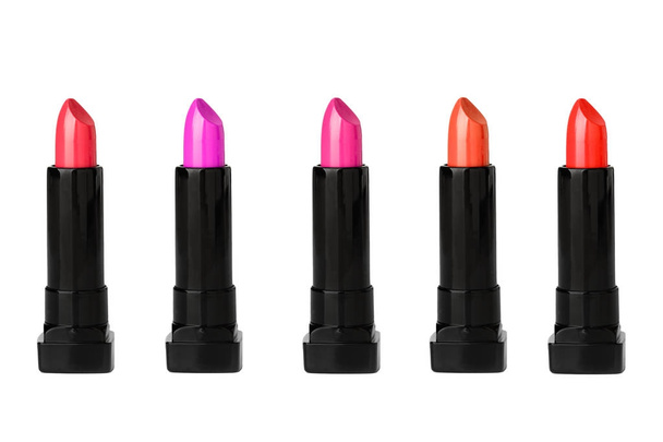 Five Colored lipstick in a cut out view - Fotó, kép