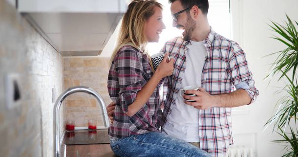 couple in love at home drinking coffee - Foto, afbeelding