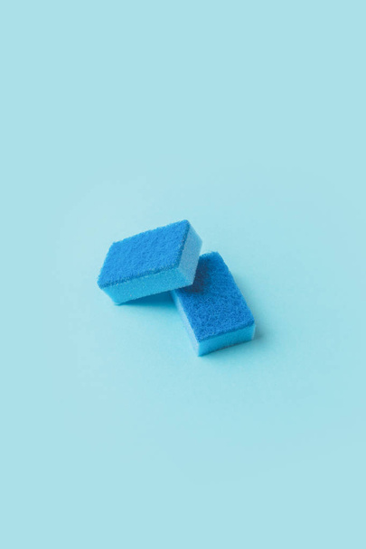 two blue washing kitchen sponges, on blue - Fotografie, Obrázek