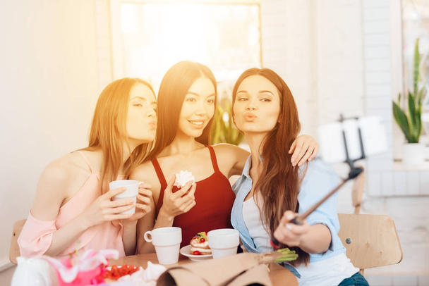 Three girls do selfie, celebrating the holiday on March 8. - 写真・画像