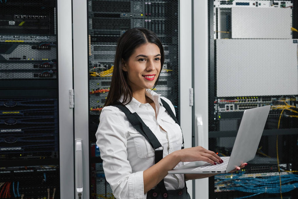 Portrait of a female executive in server room - Photo, image