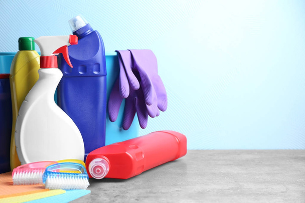Cleaning supplies on color background - Фото, зображення
