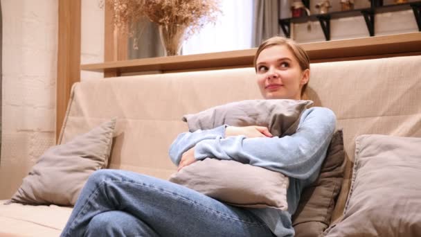 Smiling Positive Woman in Love Thinking and Dreaming, Sitting on Sofa - Video