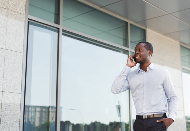 Black businessman outdoors in smart casual ware - Photo, Image