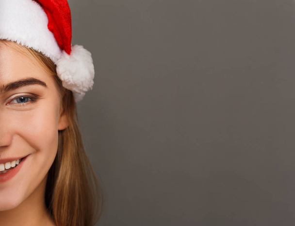 Young laughing attractive woman in santa hat - Photo, Image