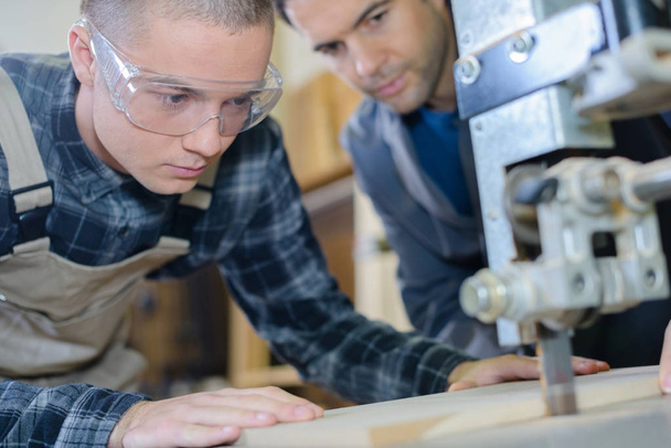 male engineer in factory using milling machine - Foto, Bild