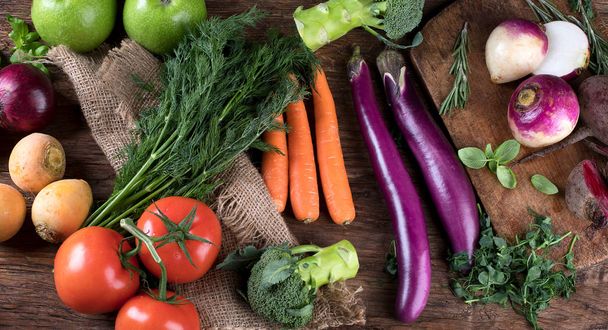 Fresh raw vegetables on wooden background. Bio Healthy food concept.Top view - Фото, зображення
