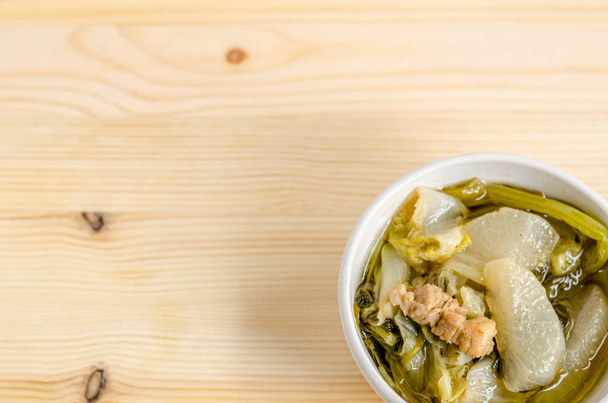 Chinese vegetable stew, mixture of vegetables and pork on wooden background - 写真・画像