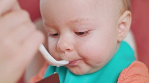A Baby Girl Eating Puree at Home - Photo, Image