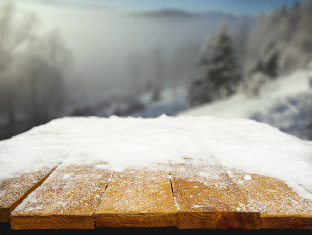 Wooden desk covered with snow - Fotoğraf, Görsel