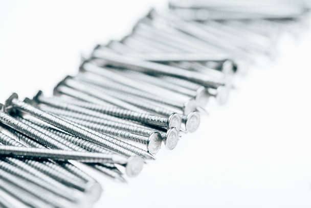 close up view of metal framing nails isolated on white - Fotografie, Obrázek