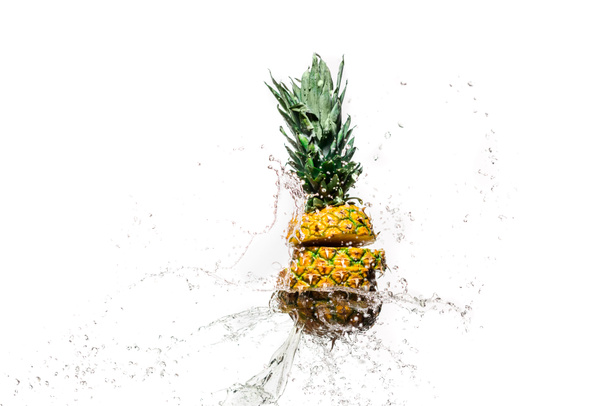 fresh sliced pineapple in water splashes isolated on white - Photo, Image